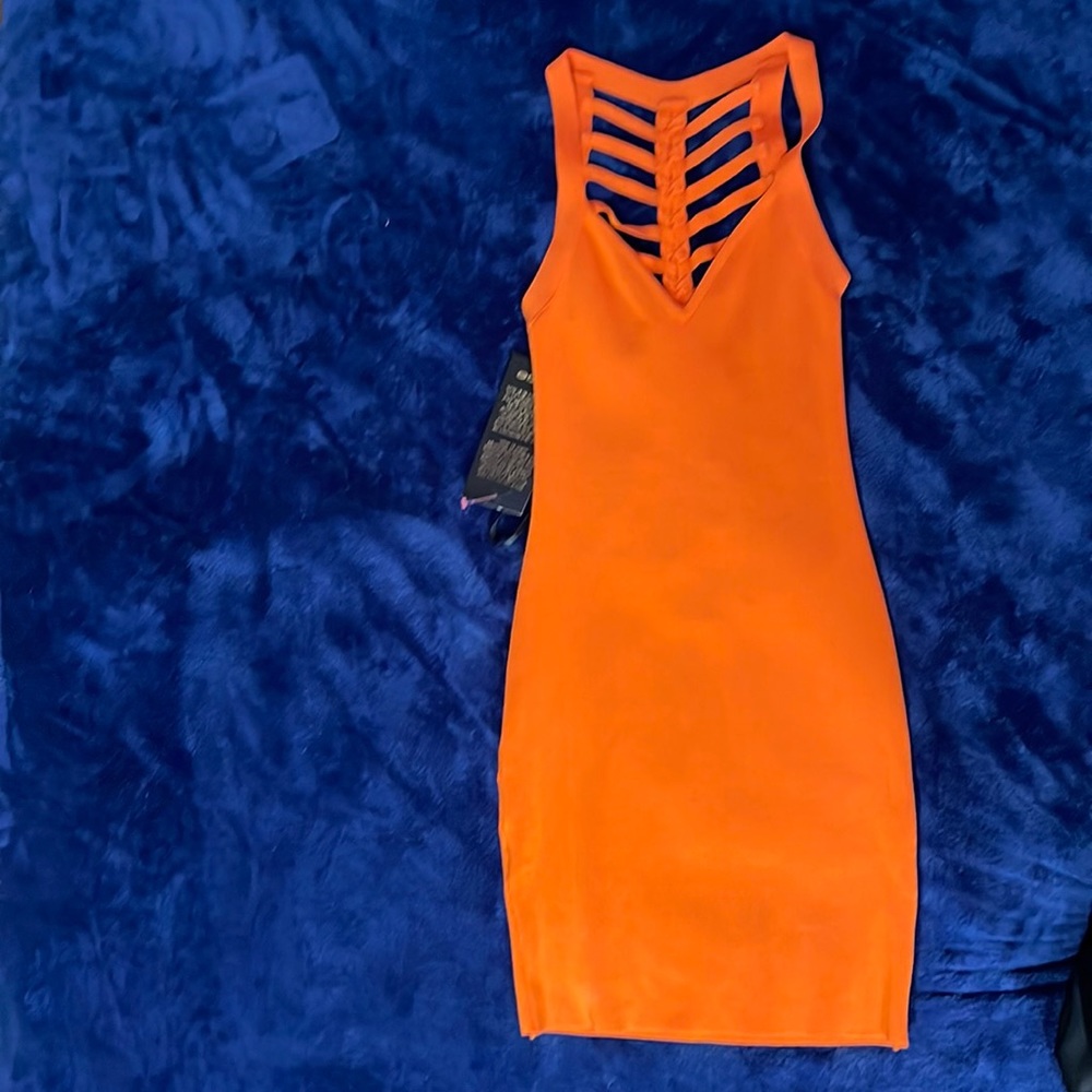 Brand new orange Bebe body on dress size XS